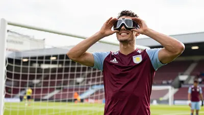 Prince William, a known Aston Villa supporter, imitated John McGinn's goggles celebration with a young fan at an...